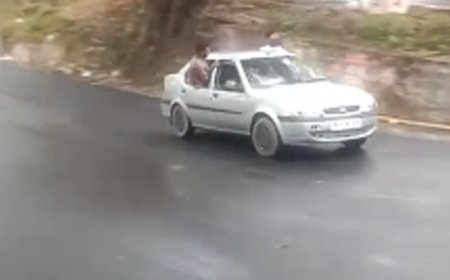 ഓടുന്ന കാറിൽ അഭ്യാസ പ്രകടനം.