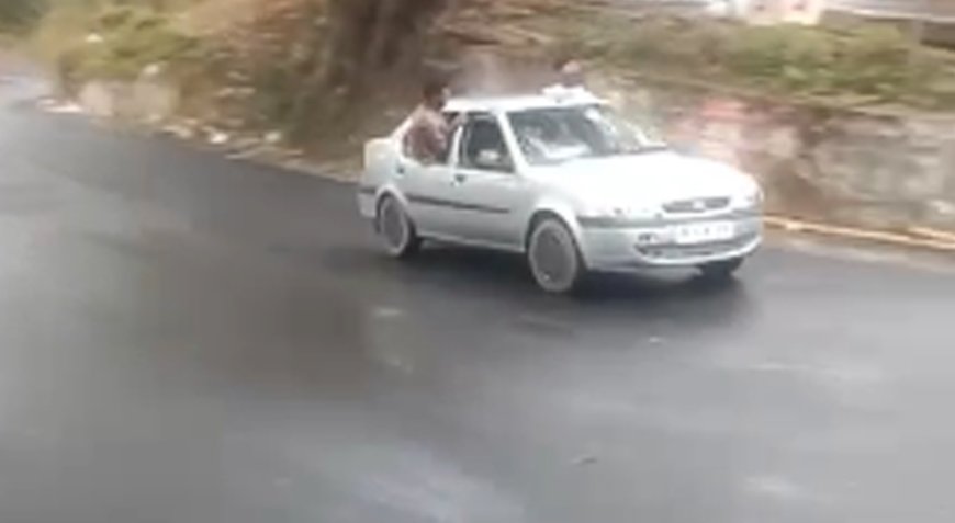 ഓടുന്ന കാറിൽ അഭ്യാസ പ്രകടനം.